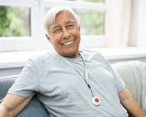 Senior with medical alert system at home