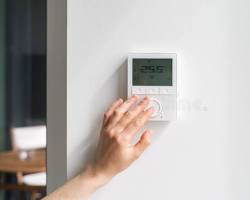 Smart thermostat on wall